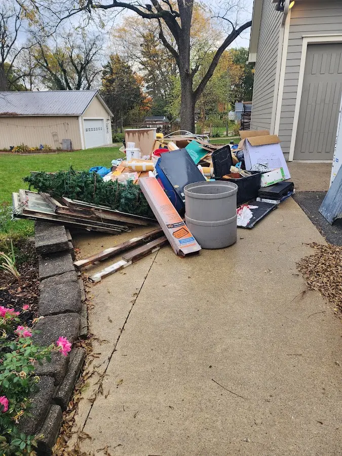 Dumpster being loaded with debris for 3 Yard Dumpster Rental in Lathrup Village